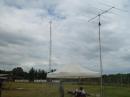 MARK, KA4TFP WORKING SIX METERS WITH KIETH, W4KQ LOOKING ON. ALSO YOU CAN SEE THE SIX METER BEAM AND THE HF TOWER.