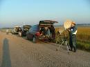 The Rover Pack for weekend two. At far left you see W9FZ preparing to work the gang in Sisseton, SD.  WA2VOI (his back to the camera) is checking on W9FZ's success.  At right, N0NAS is finishing his QSO's with the folks in the Twin Cities.  That long shadow is mine, and the photo was snapped just before it was my turn to work the folks that N0NAS is working right now.