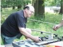 WITH PRECISION HANDS AND WORKING TOOLS, GENE,N3XKE ASSEMBLES ONE THE MONOBAND ANTENNAS CRUCIAL FOR A FIELD DAY STATION