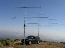 Five Bands worth of Yagi's - Done and Ready to Go ! - Various verticals for bands up to 2304 are on the roof ...
Note the "handy" Nissan Coaxial Cable Pass-Thru (aka, back passenger window), and yes, I run 1/2 and 7/8 Heliax mobile !