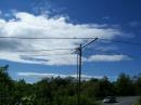 Here is the three-element SIx Meter Yagi facing west from Bald Hill Farmingville, NY, where WB2AMU operated from.  He could only raise the antenna up ten feet, because of the high winds!