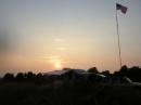 Sunset from our hilltop location - The flag is mounted on a 2 meter homebrew which is on top of a 32 ft army mast. (This mast was also used to support 2 dipoles)