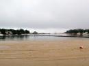 It was raining so hard that the sand on the beach couldn't even absorb it.