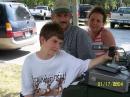 Officer Coomer and family check out the Field day operation as guests to the WC5C Field Day 2006 site.  Photo by David KB5YLG.