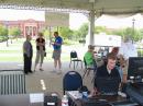 The Gazebo at Southlake Town Center provided an excellent operating environment. Adam, KK5HT on the key, John, K5JFD, talking to visitors, Larry, KD5VWS, Ken, WB4FSR and Jim, W5AP getting the GOTA station set up. Southlake City Hall in the background.