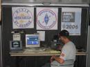 Casey Lofthouse, KD7HUS, setting up the HF station inside the trailer.