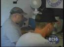Ken Head, KD7FGP, (left) and Casey Lofthouse, KD7HUS, (right) appear on the KCSG-TV News story about the Dixie Amateur Radio Club Field Day activity.  