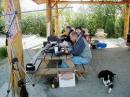 The QSO Family: Wayne (N1CKM) and Elizabeth (KL1WD) were responsible for more than one pileup at our location.

Jim (KL7JM) in the background optimizing his fantastic 500 watt amplifier. A special Thanks to Jim for the use of that amplifier, it made a huge difference.
