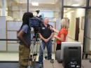 Arkansas state emergency coordinator JM Rowe, N5XFW, gives an interview to one of the local television stations in the main area of the Washington County EOC.