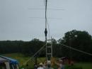 With rain apporaching quicky, members of the 10-70 Repeater Association complete the antenna set-up for the VHF/UHF station.