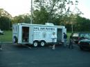 Tony, K4OCF, assists in the setup of the Civil Air Patrol communications trailer