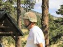 Jim Andrews, WAØNHD sporting his hard hat/SWAT team helmet used for working under hams with wrenches and hammers on top of towers. Good idea!