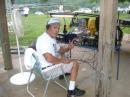 Here is John N4JOH at the 40 meter station getting ready to fire it up