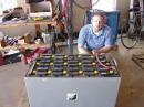 Tony AB9IO sits with one of the two batteries the day before feild day. (Anyone need a jump)
