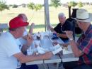 Rumor has it that FD runs on the gasoline in the generators, but we all know it really runs on the food! Here it appears that KD5SMC and KI5QT are trying to enjoy their chicken-tender dinner while listening to N5MVL tell of exciting 6-meter band openings. :-)