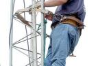 Shawn Kyker (KC0SWG) installs a set of HF beam antennas on a temporary tower prior to the start of Field Day exercises June 24.