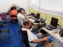 KU4J with his solar shield, Vic (K4RVH) trying to hear, and Brent (KE4YNY) listening and watching.