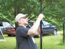 N1TOX, John, West River Radio Club President, runs his Buddipole up to full height.