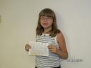 Laura Hopper, Age 9 shown with her CSCE after passing the Technician test. Her new callsign? KC0YCB.