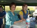 Visitor Gwen logging, Amber KD7CSK operating, Visitor Nancy watching at the 40M Phone Station.