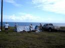Club members work to tear down the site Sunday morning.