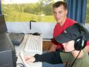 Brady Savignac making his first amateur radio contact. Supervising is Travis, VE3WO