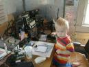 Here's a pic of daddy's little operator/gopher at my semi-temporary station, looking over towards the ICOM 746, just hours before the start of the contest.