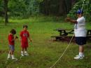 CARMEN, KE3QB GETS SOME HELP FROM HIS SONS TO HANG THE 75 METER WIRE.."DADDY, IF I PULL THIS OUT, WHAT HAPPENS?"