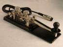 Danish Amplidan Professional Marine Telegrapher's Key used on ocean-going vessels and at KB4T. It's long arm and great heft make it a stable and well-balanced key that is easy to use even for long periods.  