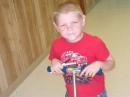 My son Phoenix riding his scooter at the volunteer fire department FD site.