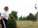 Bonnie Krupa, KC9EMV, helps to untangle an 80-meter loop antenna as Jordan Carter, K9NZF, climbs a temporary tower as the emergency communications group EmComm ECI sets up the W9YFD Field Day site in Muncie, IN on Saturday, June 23, 2007.