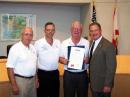 Sam N2OF, Bill W1WAB, and SCC President David N8PF receive the Hillsborough County Proclamation from Commissioner Blair on May 15