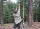 Dave uses a slingshot to fire a fishing line high into the pines, then hoists another 100 feet of feed line.