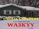 The scene outside my QTH the morning after the contest.  Half of my G5RV antenna is buried under 22 inches of snow on the roof.
