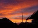 W4IY 222 Mhz stack of C3I antennas with Omni Stack above.  Mast mounted preamp and remote antenna switch mounted on mast and a Beautiful Sunset.