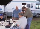 L - R Larry, Stu WA0DYJ, Ted and Rick building the new power cables to feed the operating tent from the 30KW Diesel Generator.