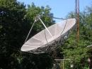 The 8.5 m dish at K2UYH. Dense foliage limits system efficiency at moon elevations less than about 25 degrees.