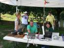 Newly licensed ham, Todd Ward, KJ4IVL working a Puerto Rico station on the GOTA Station as his wife Lana looks on.  Susan Melvin, K4ZXN (DEC Area 13) coaches GOTA Station.

The GOTA station also doubled as our Information table.